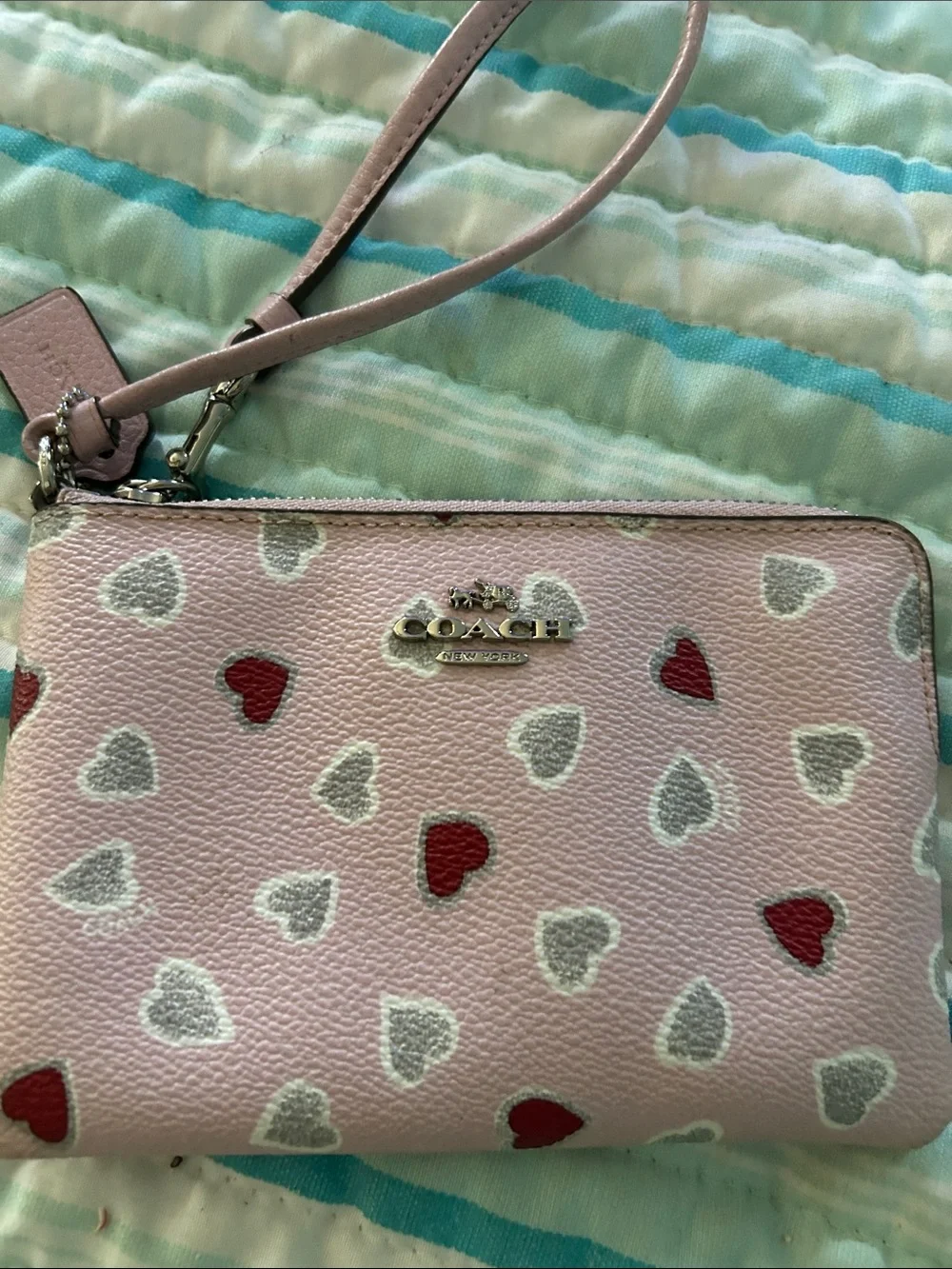 Coach Pink Leather Heart Wristlet with Red & Silver Hearts.  Two small marks
